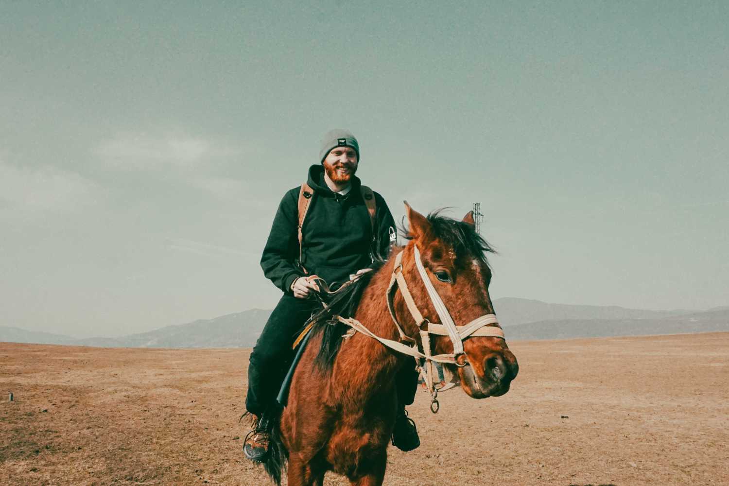 A man riding a horse in beautiful nature