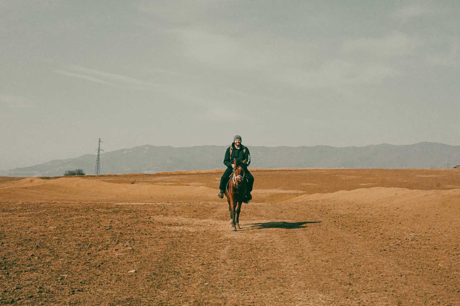A man riding a horse in beautiful nature